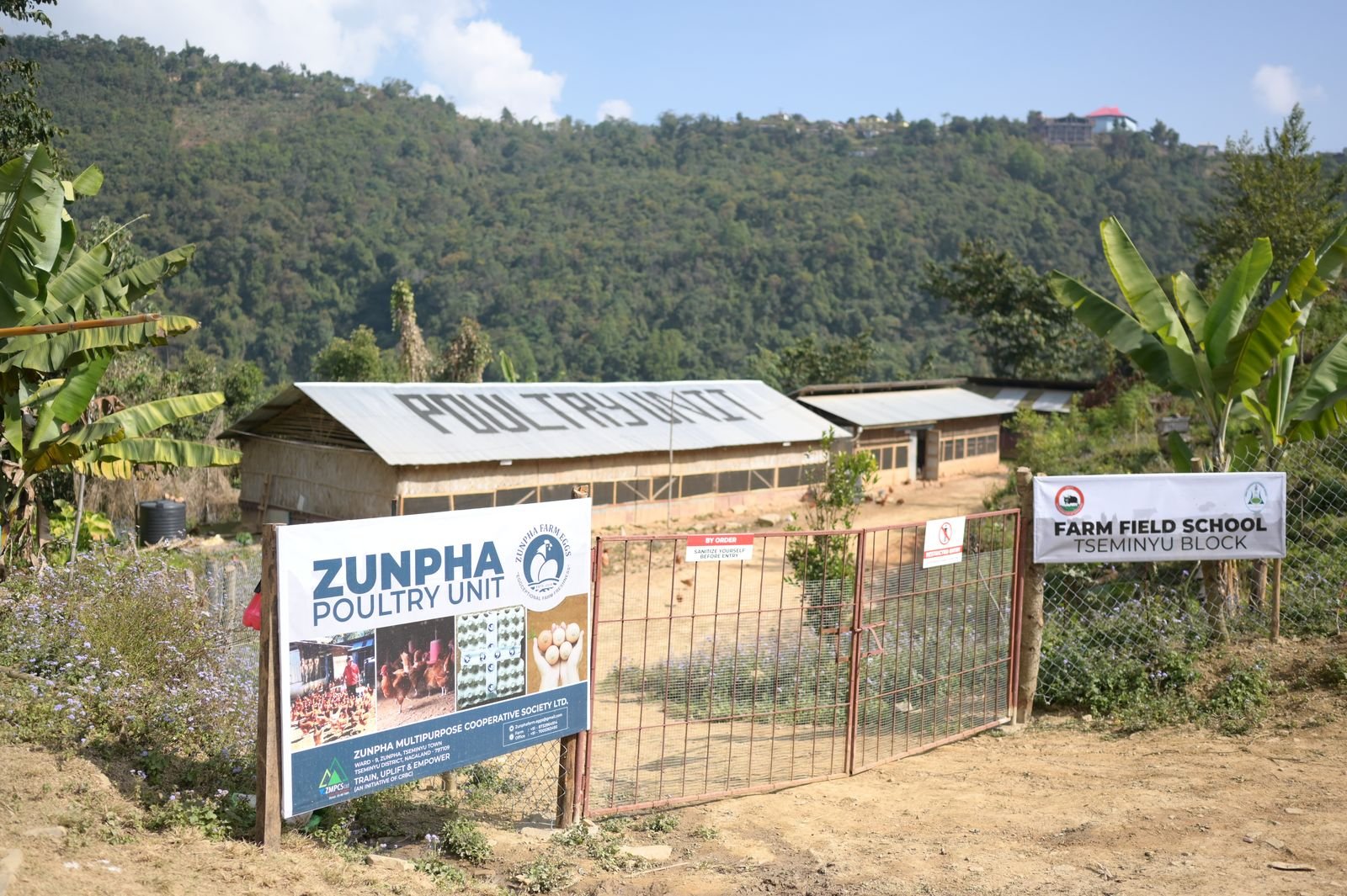 The Zunpha Poultry Unit gate with the Farm Field School Tseminyu Block sign