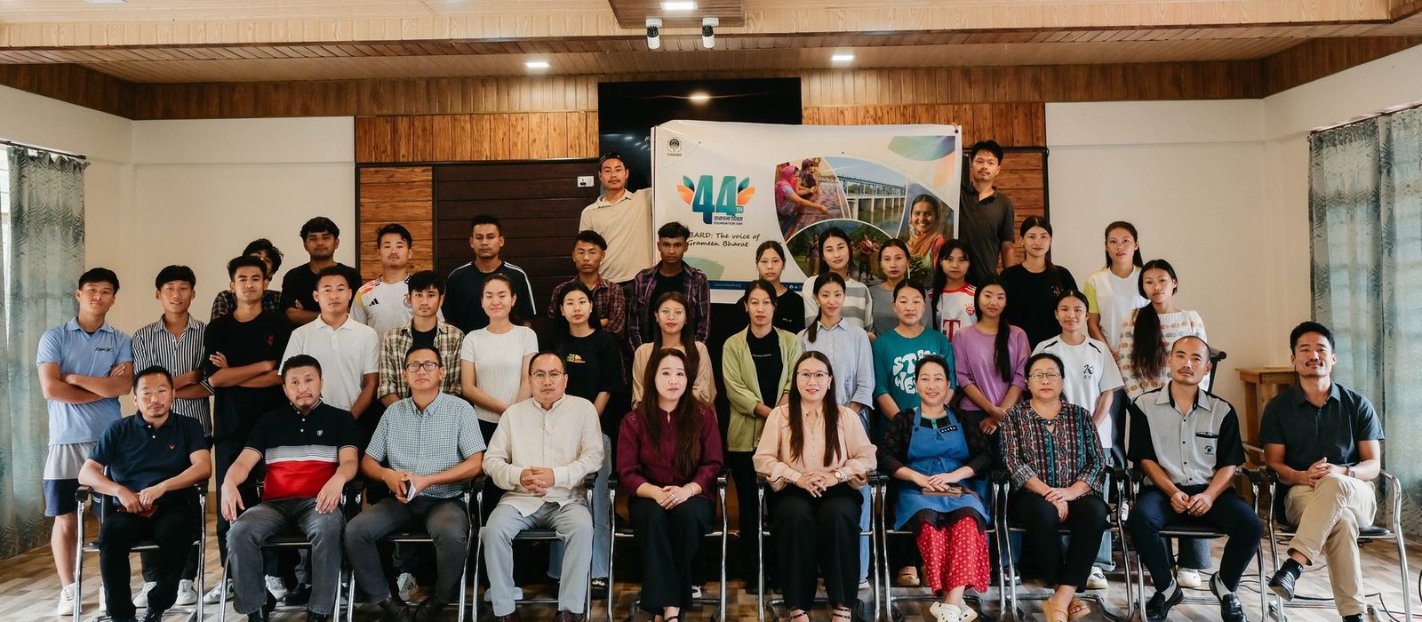 Members of Zunpha Multipurpose Cooperative Society Ltd. and the Kenono team seated and standing in rows at a NABARD Foundation Day gathering